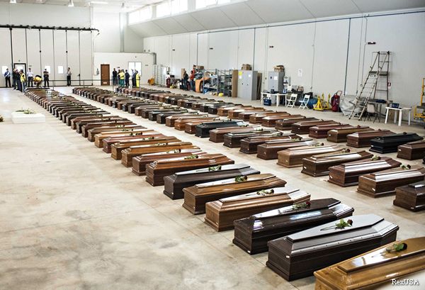 Coffins in the Lampedusa airport hangar